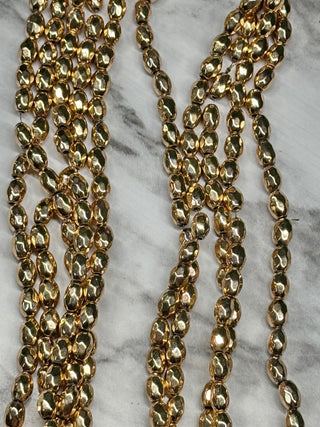 Magnetic Hematite Faceted Oval Beads Strand - 7x5mm - Gold - Natural