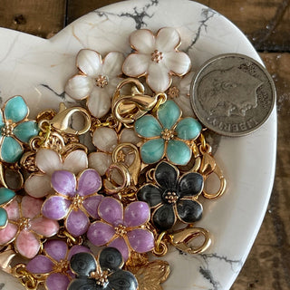 10 piece small flower shaped charms with lobster clasp